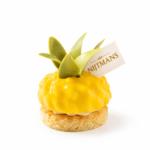 Gele ananaspatisserie met gouden detail